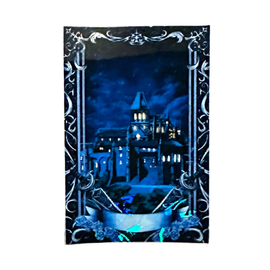Gothic-style castle at night with decorative border