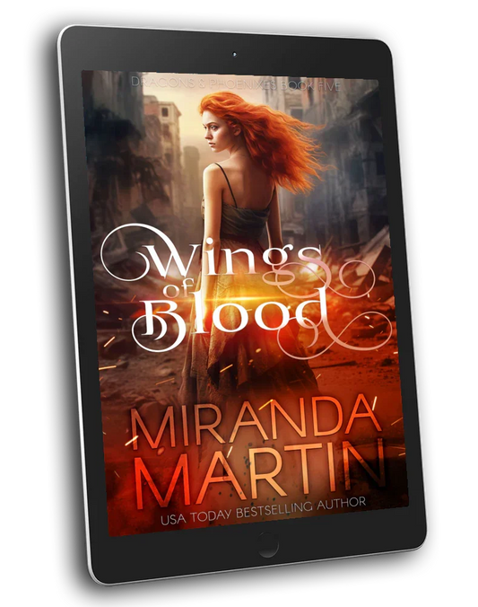 A digital tablet displaying the cover of the book 'Wings of Blood' by Miranda Martin, which is part of the Dragons & Phoenixes series.