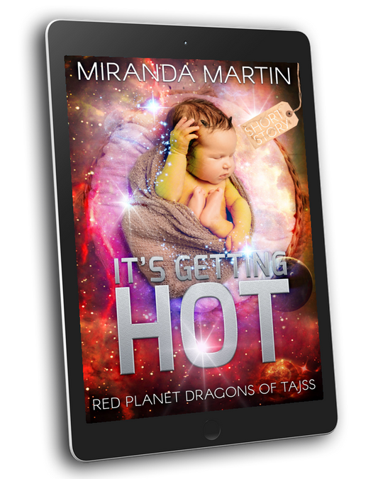 A tablet device displaying a book cover for 'It's Getting Hot' by Miranda Martin, with the subtitle 'Red Planet Dragons of Tajss'. The cover art features a baby wrapped in a blanket against a colorful cosmic background with glowing stars and nebulae.