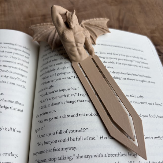 Dragon-shaped bookend on an open book