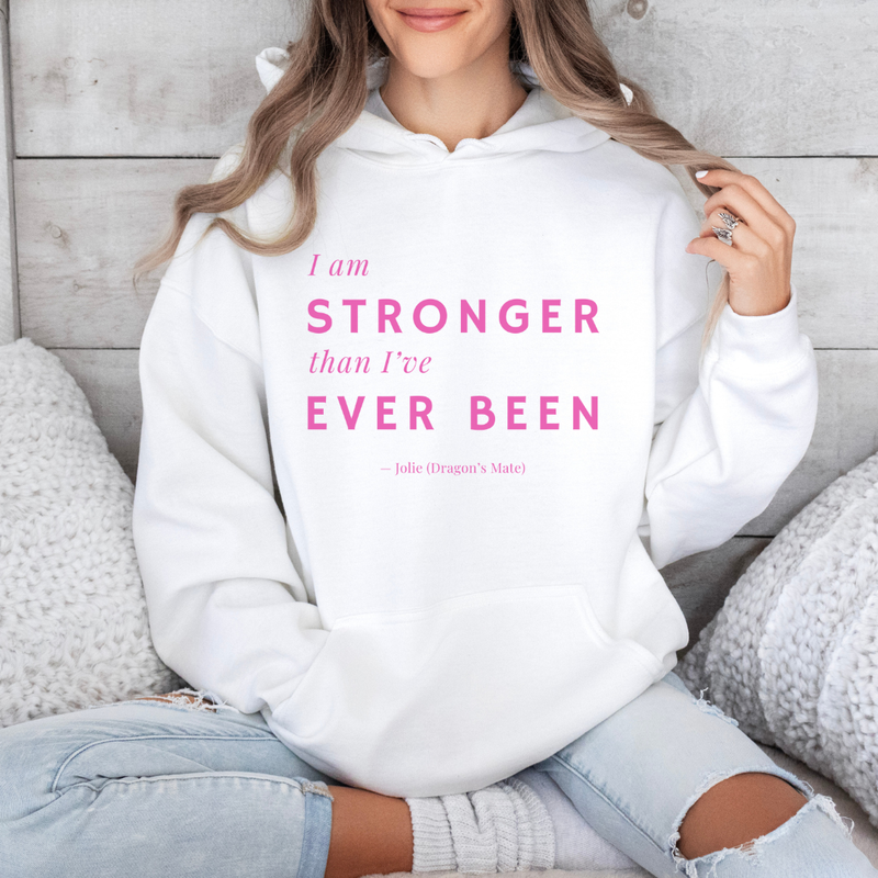 Person wearing a white hoodie with motivational text in pink.