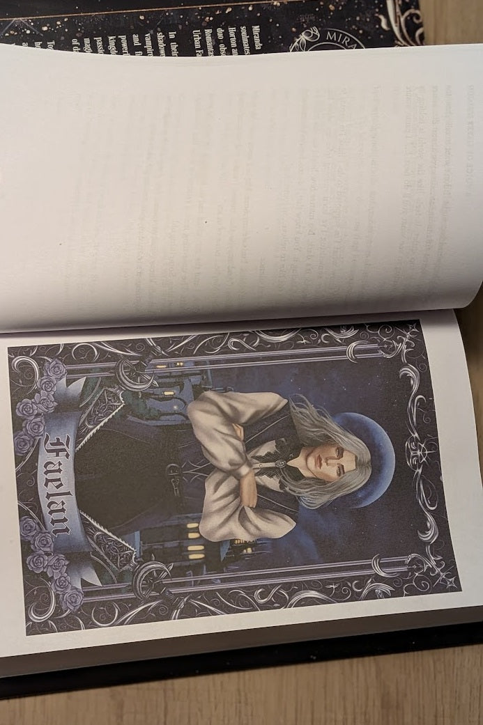 Open book with a tarot card featuring a person in a hooded robe on a dark background.