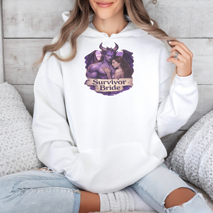 Person wearing a white hoodie with a graphic design and text, sitting on a wooden floor.